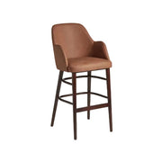 Aztec Bar Stool LegsN109 CognacVintageElegance Faux Leather bar stool with warm cognac faux leather upholstery and dark wooden legs, designed for sophisticated commercial interiors.