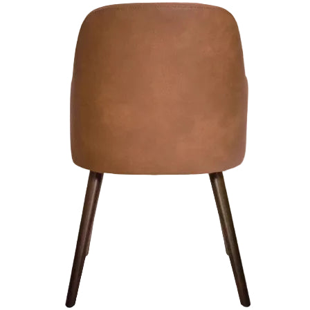 Back view of the Aztec Arm Chair - Cognac showcasing its smooth cognac-colored upholstery and elegant dark wooden legs, designed for comfortable seating.
