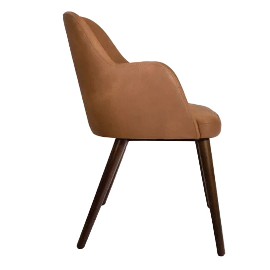 Aztec Arm Chair - Cognac with smooth leather upholstery and slender wooden legs, designed for stylish comfort and durability in modern commercial interiors.