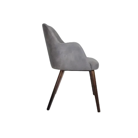 Side view of the Aztec Arm Chair - Steel Grey featuring smooth upholstery and tapered wooden legs designed for stylish commercial interiors.