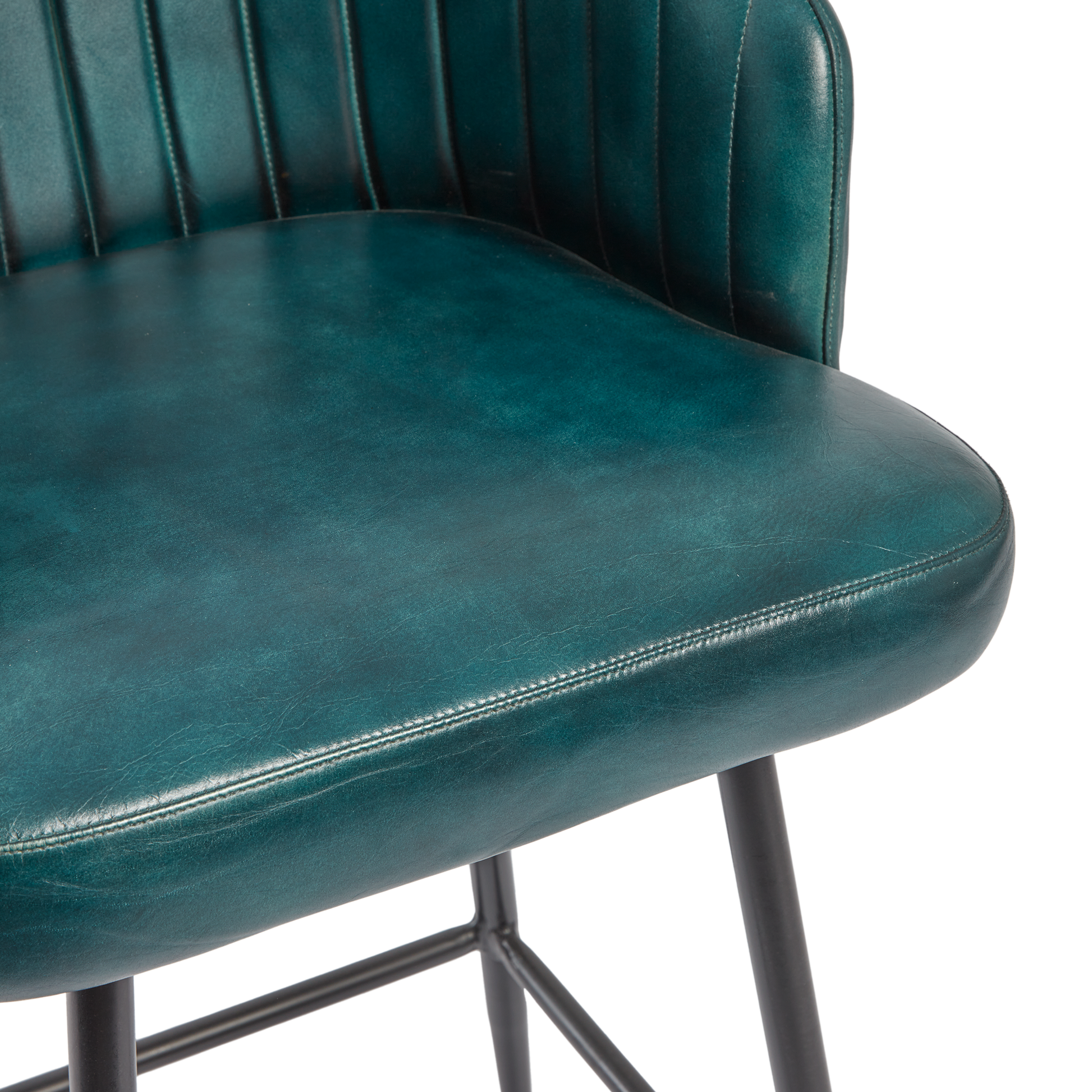 Close-up of the smooth, vintage blue leather seat and vertically stitched backrest of the Brooklyn Leather Tub Chair - Vintage Blue, highlighting its premium upholstery and sturdy black metal legs.