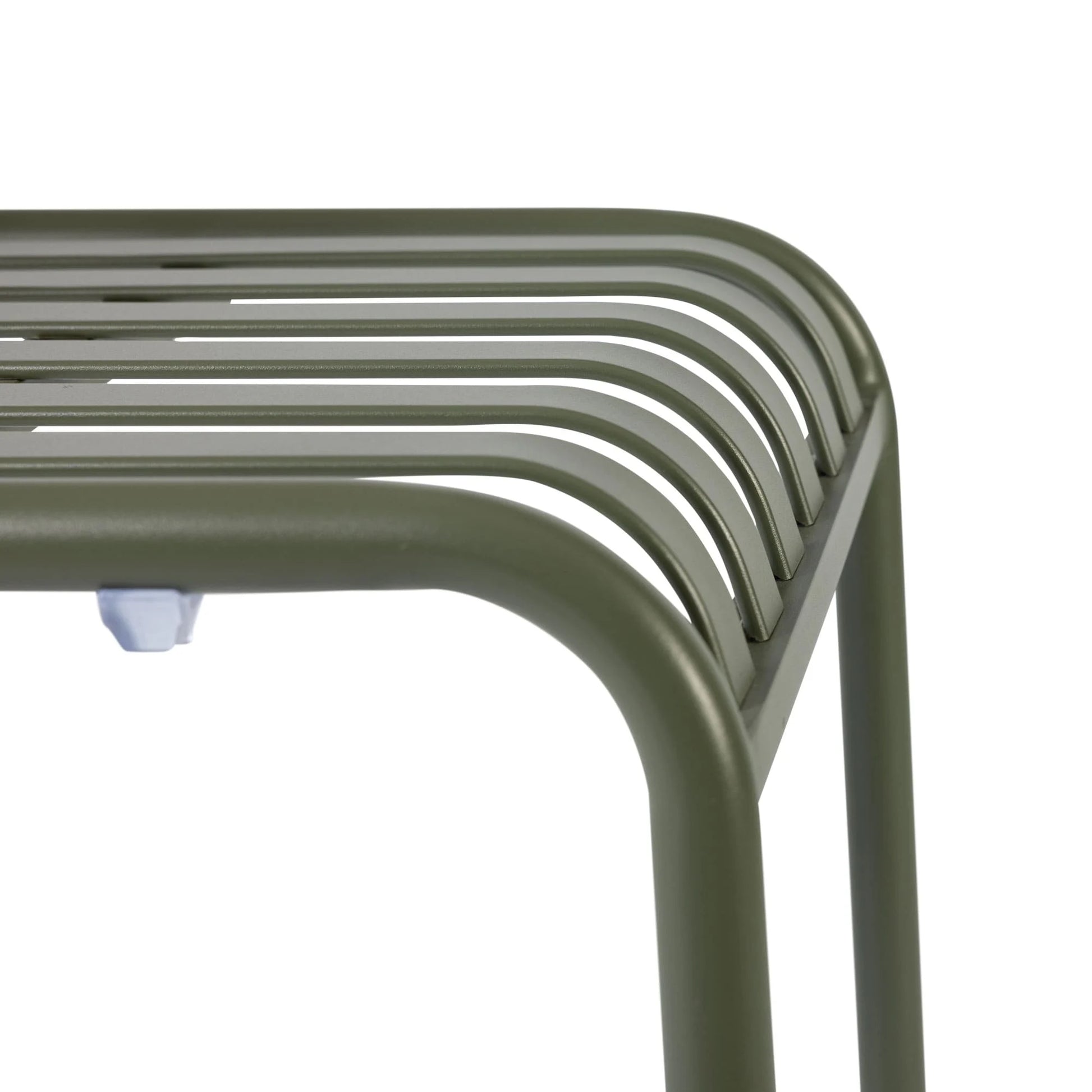 Green metal stool with curved design on a white background. Commercial Henley Side Chair in Pine Green featuring a lightweight powder-coated aluminium frame, ergonomic slatted design and stackable construction for hospitality, restaurant, hotel, café and outdoor seating applications.