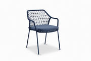 Klein Stacking Arm Chair with cushion in Indigo Blue, featuring a contemporary commercial design with integrated armrests and durable construction, suitable for restaurants, cafés, hotels, bars, and hospitality environments.
