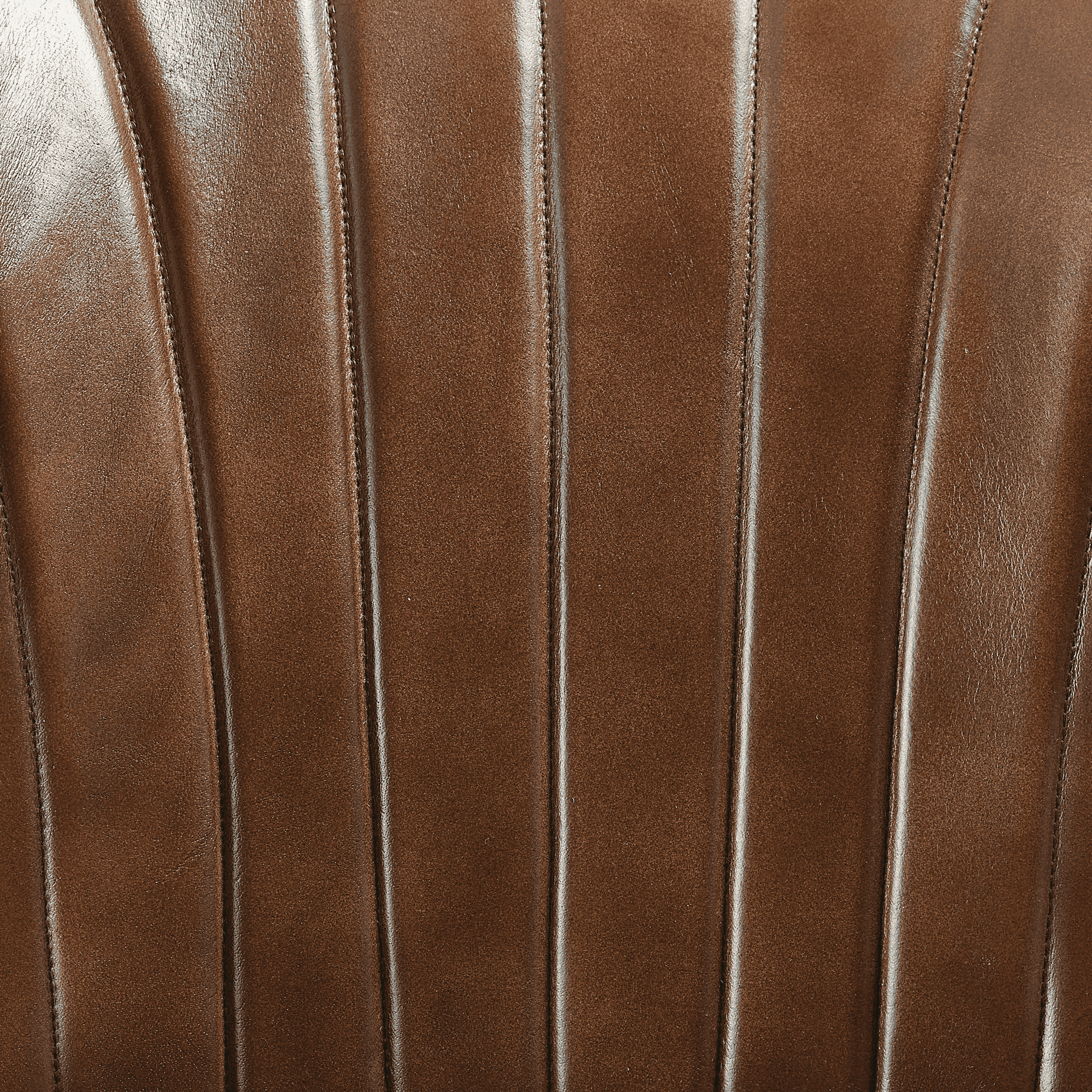 Close-up view of the rich genuine pecan brown leather upholstery with vertical stitching detail on the Lars Bar Stool - Genuine Pecan Brown Leather.