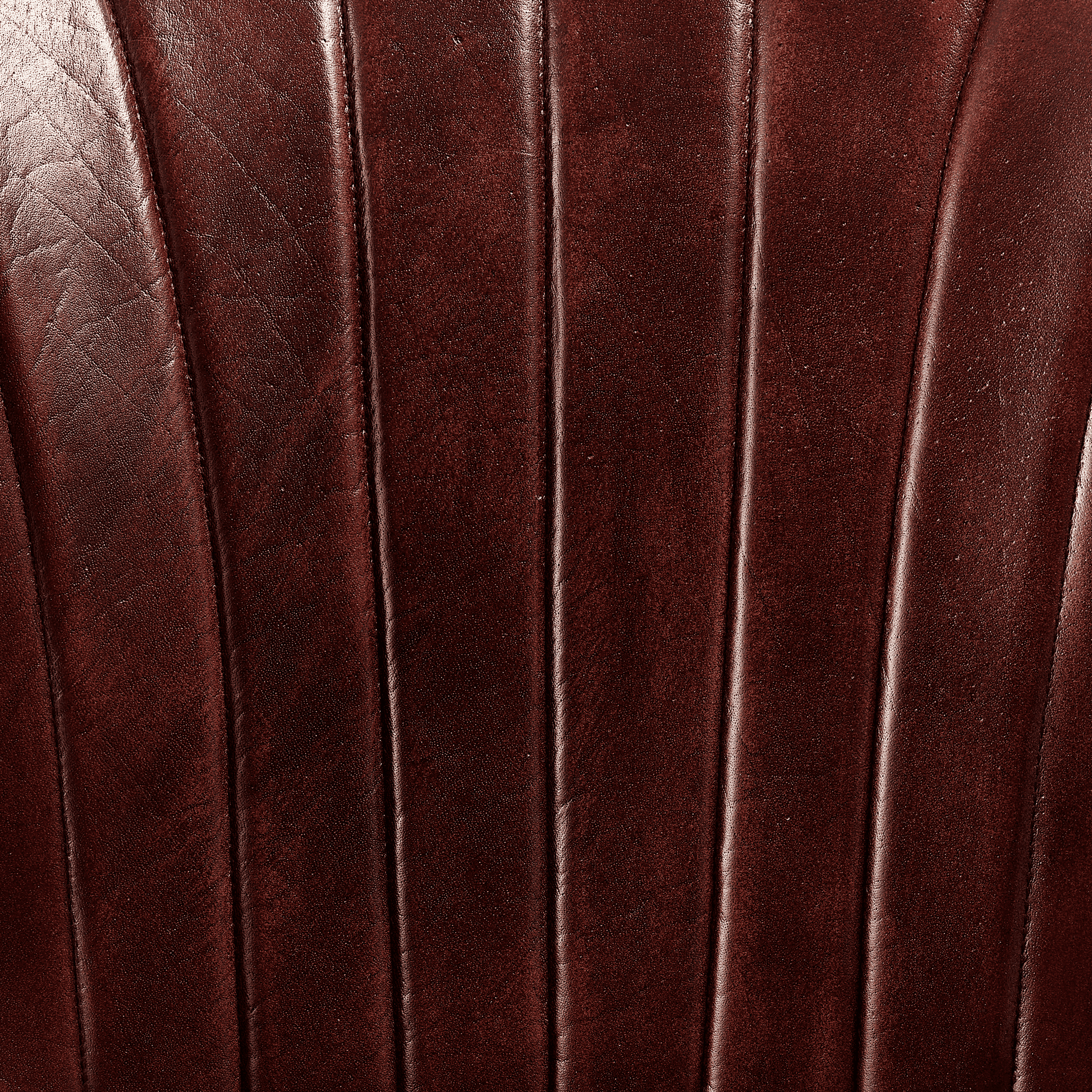 Close-up detail of the rich genuine claret red leather upholstery on the Lars Side Chair - Genuine Claret Red Leather, showing smooth texture and vertical stitching.