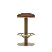 The Rafferty Bar Swivel Stool features a vintage tan faux leather seat and backrest paired with a sophisticated brass-finish stainless steel frame. Decorative vertical ridges on the frame add texture and elegance, while the integrated circular footrest enhances guest comfort. Designed for commercial hospitality environments, the stool includes a smooth swivel function and combines timeless styling with durable construction, making it ideal for bars, restaurants, hotels, lounges, and premium dining spaces.
