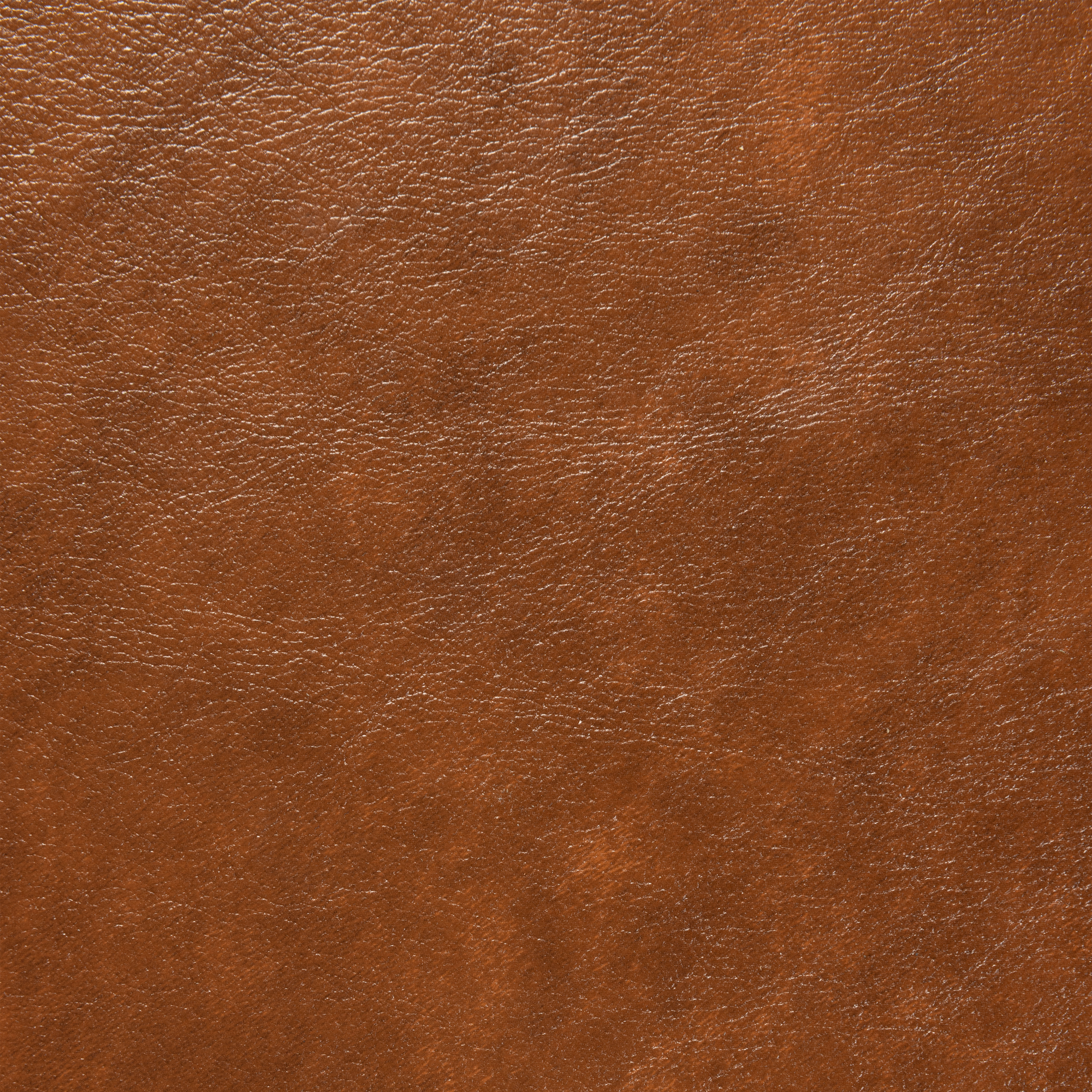 Close-up of the Lascari Vintage Tan seat pad texture on the Relish Bar Stool - Beech Satin Black - Natural Cane Back - Lascari Vintage Tan Seat Pad, showcasing rich tan leather detail.
