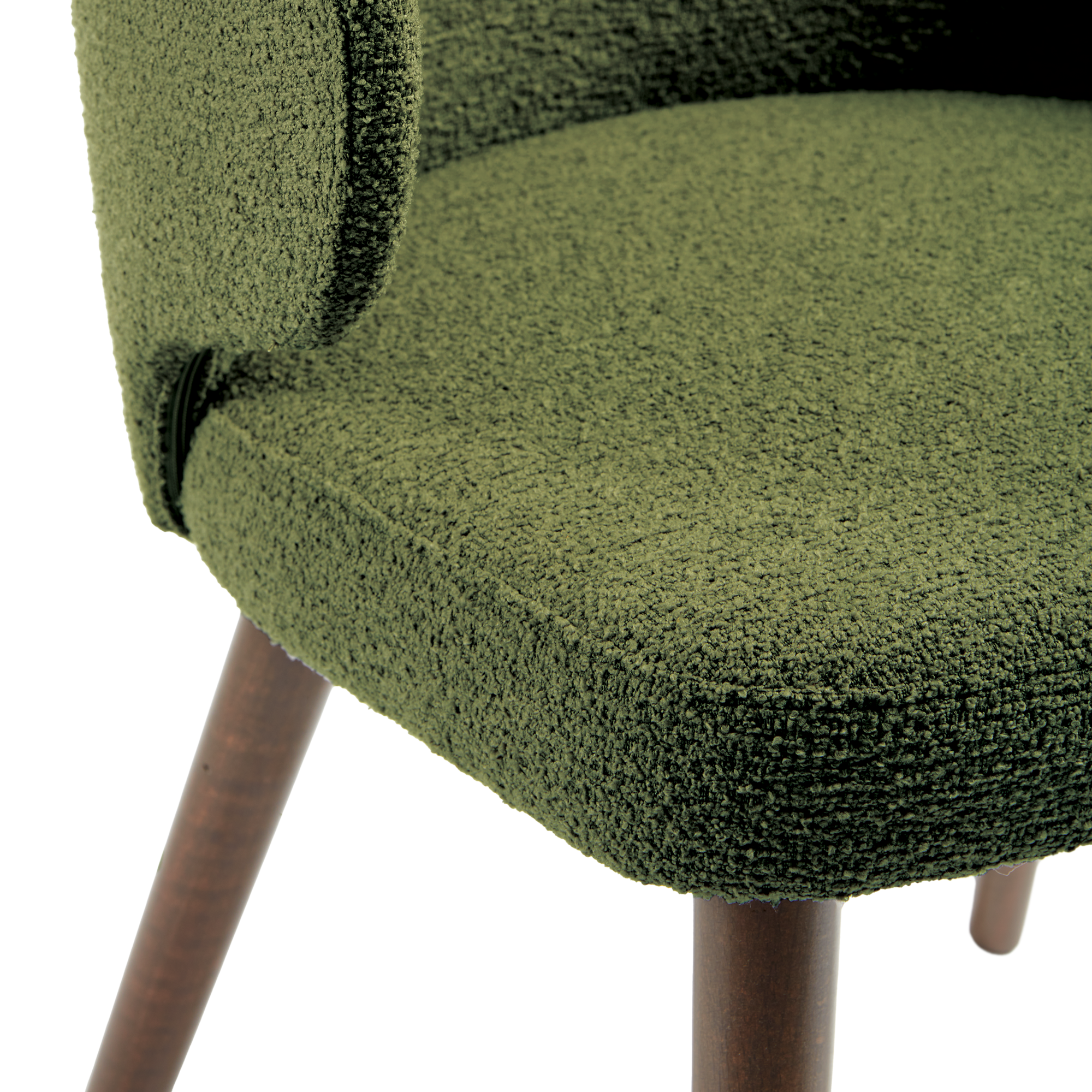 Close-up of the textured upholstery and wooden leg detail of the Selma Armchair - Forest Green, showcasing its high-quality fabric and craftsmanship.