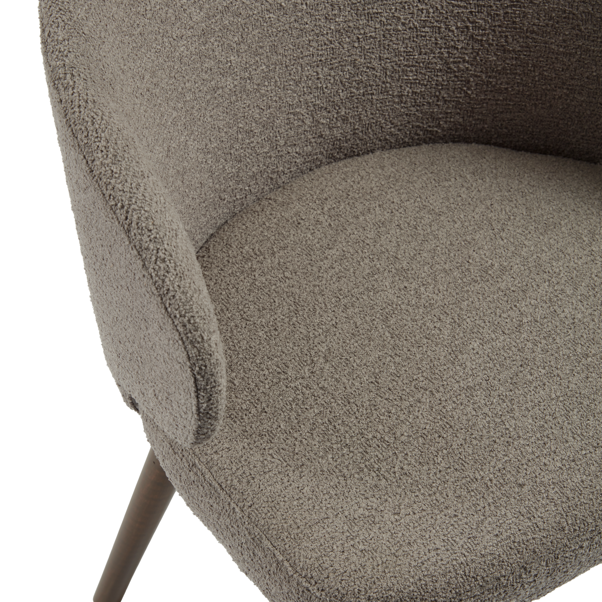 Close-up view of the textured upholstery and curved armrest of the Selma Armchair - Grey, highlighting its comfortable and stylish design.
