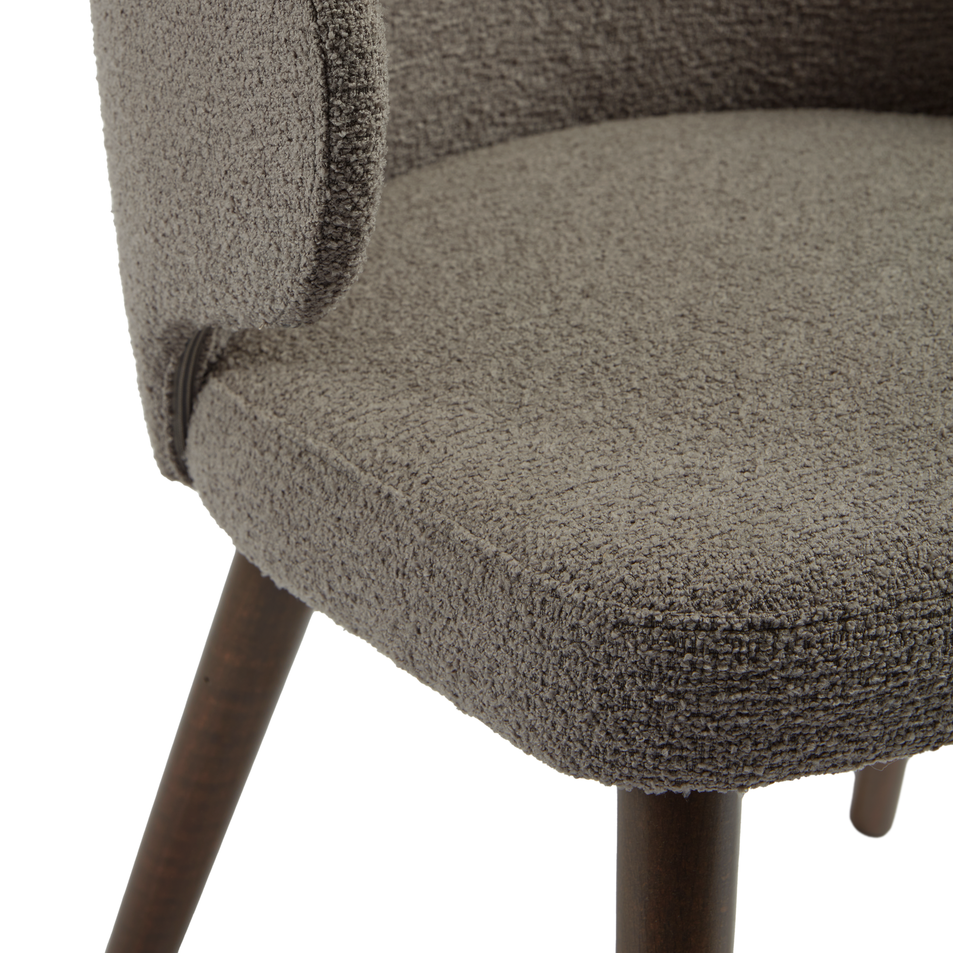 Close-up view of the textured fabric upholstery and wooden legs of the Selma Armchair - Grey, highlighting its refined craftsmanship and durable design.