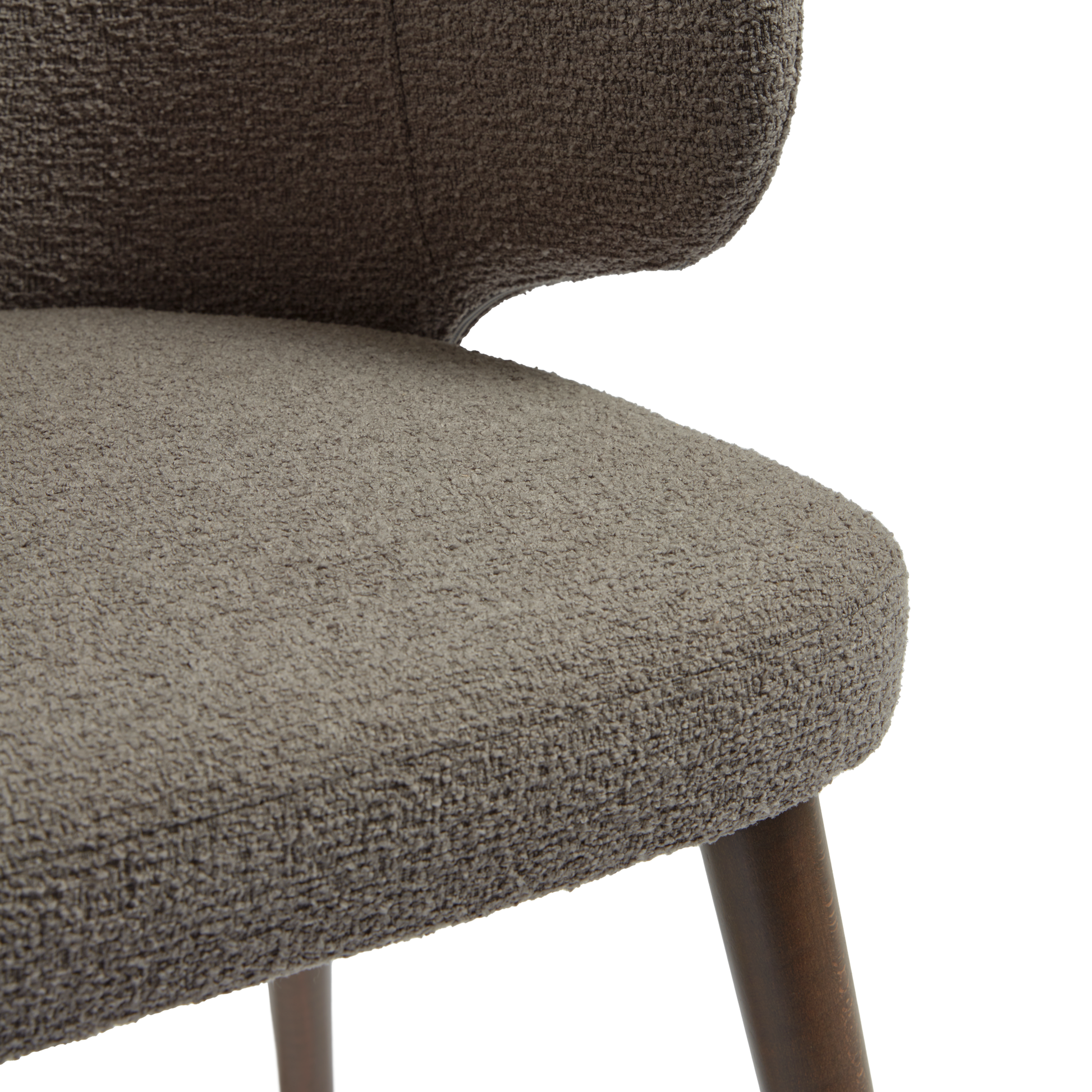 Close-up of the textured fabric upholstery and wooden leg detail of the Selma Armchair - Grey, highlighting its durable material and modern design.