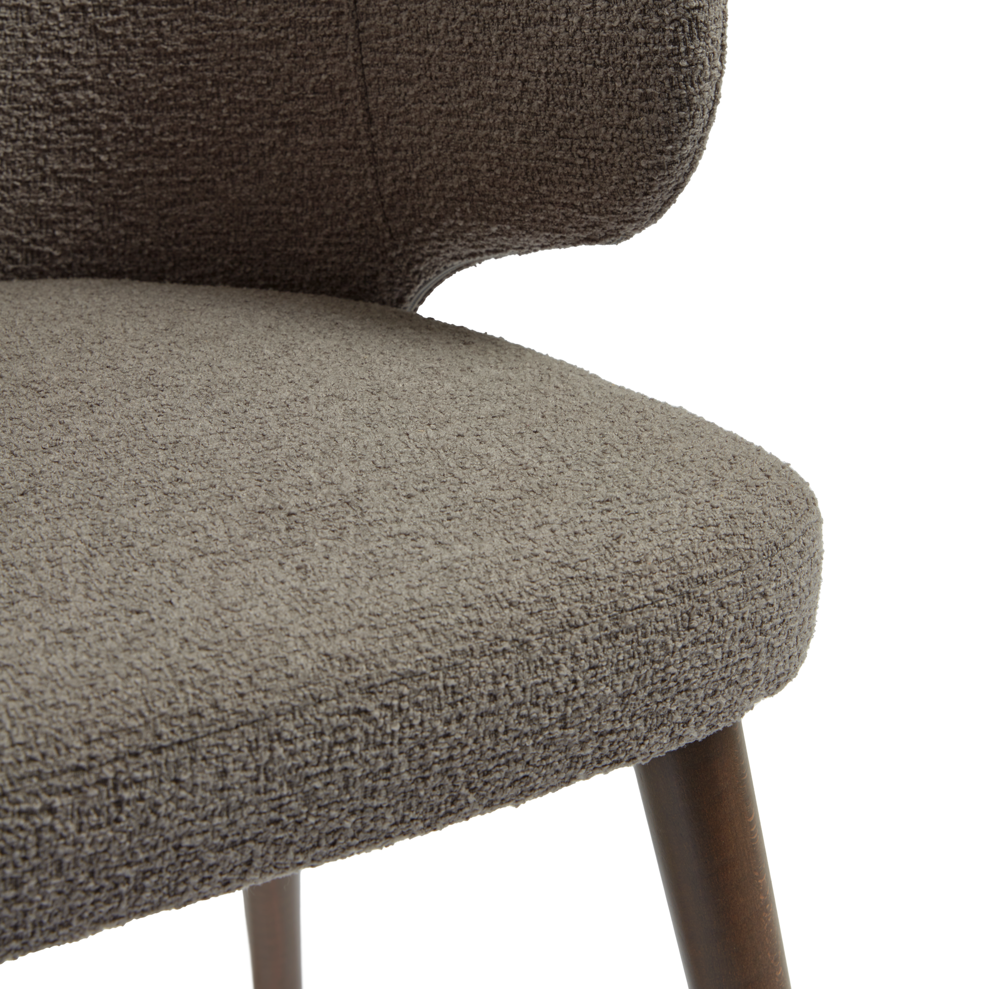 Close-up of the textured fabric upholstery and wooden leg detail of the Selma Armchair - Grey, highlighting its durable material and modern design.