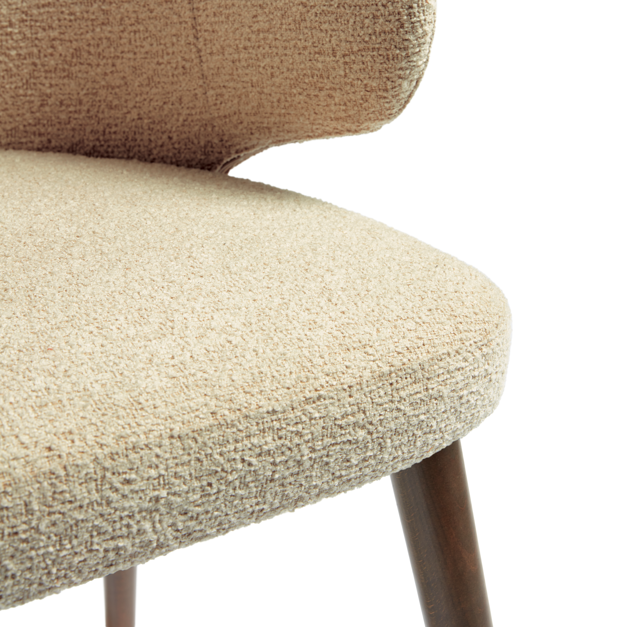 Close-up detail of the woven textured upholstery and wooden leg of the Selma Armchair - Natural showcasing its craftsmanship and natural fabric in a neutral tone.