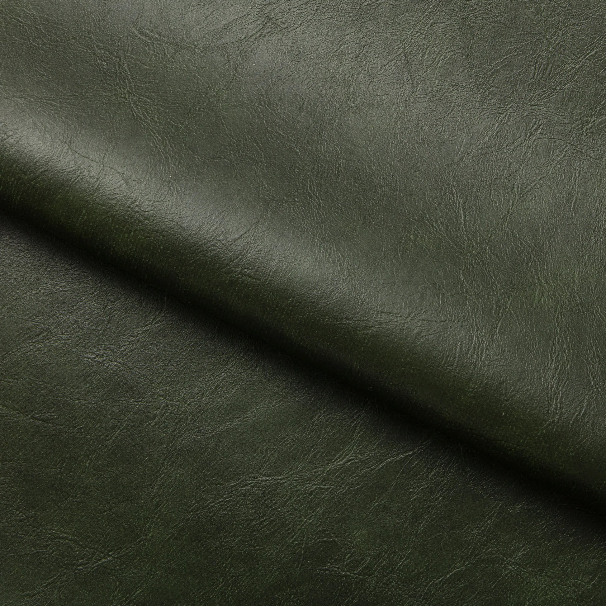 Rafferty Bar Swivel Stool upholstered in vintage tan faux leather with a brass-finished stainless steel frame, featuring decorative vertical ridges, a circular footrest, and swivel functionality, ideal for hospitality, restaurant, hotel, and bar interiors. Dark green leather texture with a diagonal line