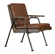 Witham Accent Chair featuring durable brown faux leather upholstery, walnut-stained ash wood armrests, and an industrial-style black metal frame, perfect for hotels, reception areas, workplace breakout spaces, lounges, cafés, and commercial interiors. Brown leather armchair with metal frame on a beige background