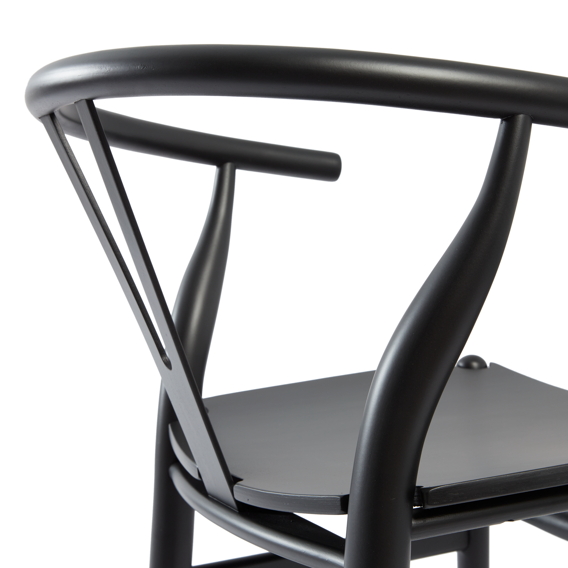 Close-up view of the satin black finish and elegant curved design of the Wishbone Style Armchair - Solid Beech - Satin Black, highlighting craftsmanship and smooth wood texture.